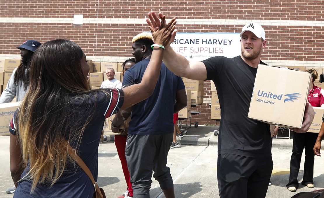 JJ Watt helps load up a car with relief supplies for Hurricane Harvey survivors in Septemner, 2017. 