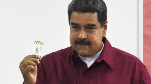 Venezuelan President Nicolas Maduro casts his vote during the presidential elections in Caracas on May 20, 2018.