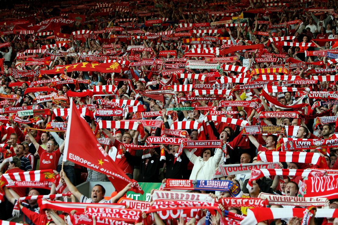 Liverpool fans cheer their team from the Kop.