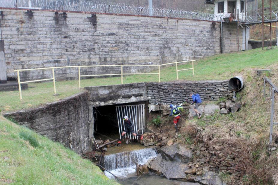 Barkley runners jump into a creek and wade through a tunnel that goes under Brushy Mountain State Penitentiary. It was the prison escape of James Earl Ray -- who assassinated Martin Luther King Jr. -- that helped inspire the race.
