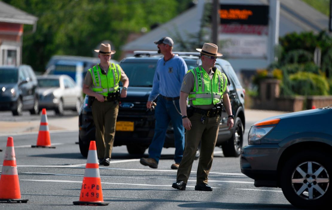 Maryland State Police divert traffic near the spot where an officer was run over Monday.