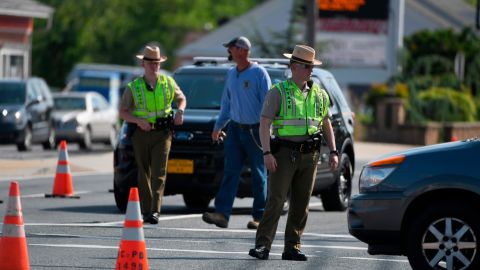 Maryland State Police divert traffic near the spot where an officer was run over Monday.