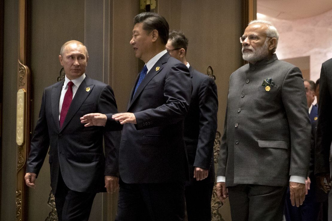Russian President Vladimir Putin, Chinese President Xi Jinping and Indian Prime Minister Narendra Modi arrive for the Dialogue of Emerging Market and Developing Countries on the sidelines of the 2017 BRICS Summit in Xiamen, southeastern China's Fujian Province on September 5, 2017.