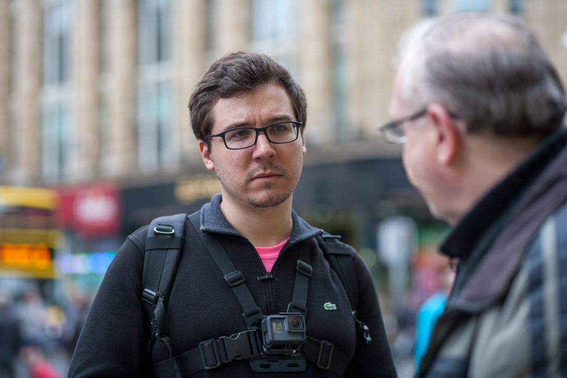 Nathan Berning speaks to an Irish voter in central Dublin. Berning says the group's members wears GoPros for their "safety" and to help record conversations for a documentary they are making.