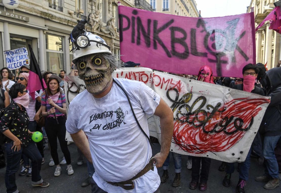 A protester wearing a T-shirt reading "Angry sewer worker" in Lyon.