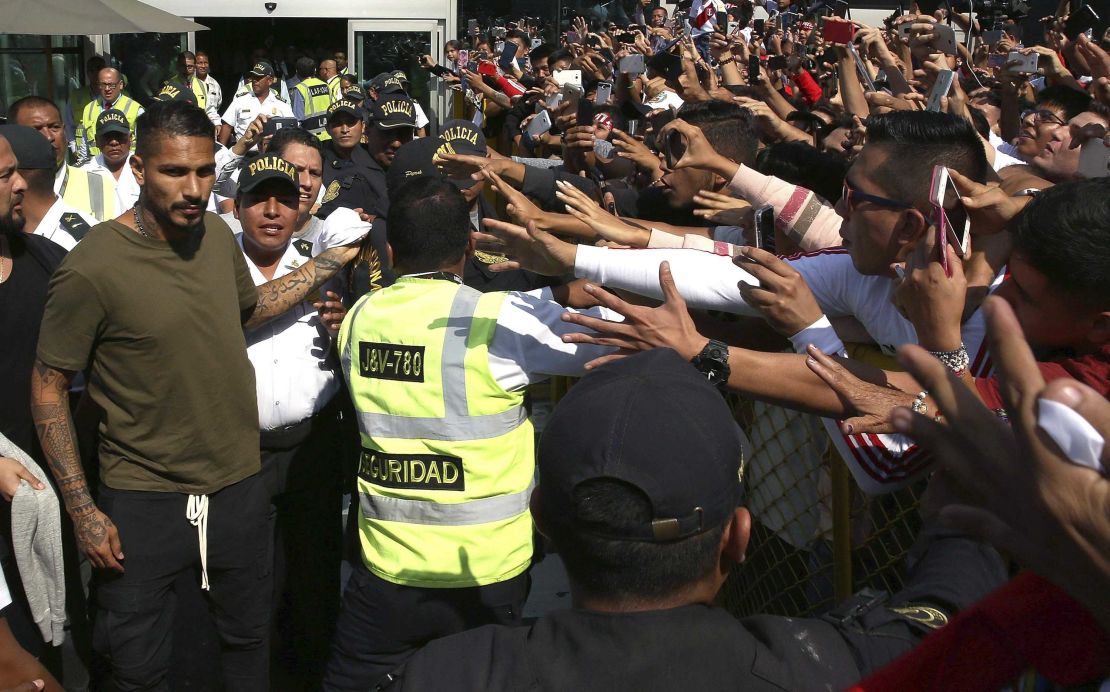 Guerrero, left, is greeted by hordes of Peru fans in Lima.