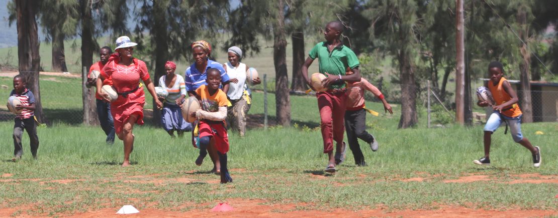 The charity not only visits schools but also holds sessions in communities where adults can also play rugby and learn about the virus