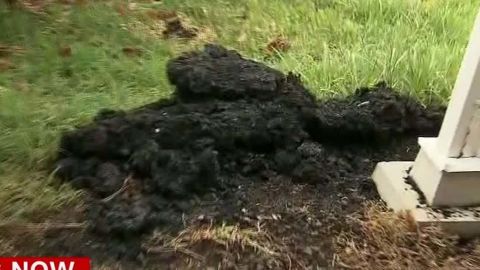 A lava bomb landed next to a house guarded by Darryl Clinton.