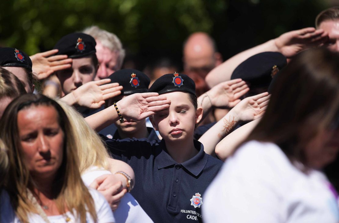 A cadet salutes during a minute's during the outside broadcast of the Manchester Arena commemoration.