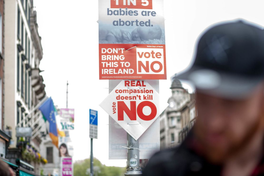 Signs from the No campaign are seen on a Dublin street.