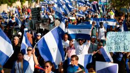 People take part in a march marking a month since the beginning of protests against the government in Managua on May 18, 2018. - The Inter-American Commission on Human Rights on Friday called for Nicaragua's government to "immediately halt the repression of protests" against President Daniel Ortega, as the death toll rose to 63. (Photo by DIANA ULLOA / AFP)        (Photo credit should read DIANA ULLOA/AFP/Getty Images)