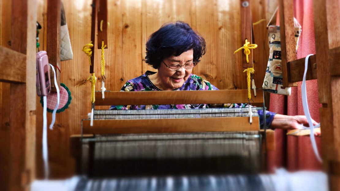 Natsuko Maenaka, 84, weaves and tries to learn new things to stave off dementia. 