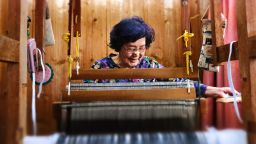 Natsuko Maenaka, 84, still weaves and tries to learn new things to stave off dementia. 