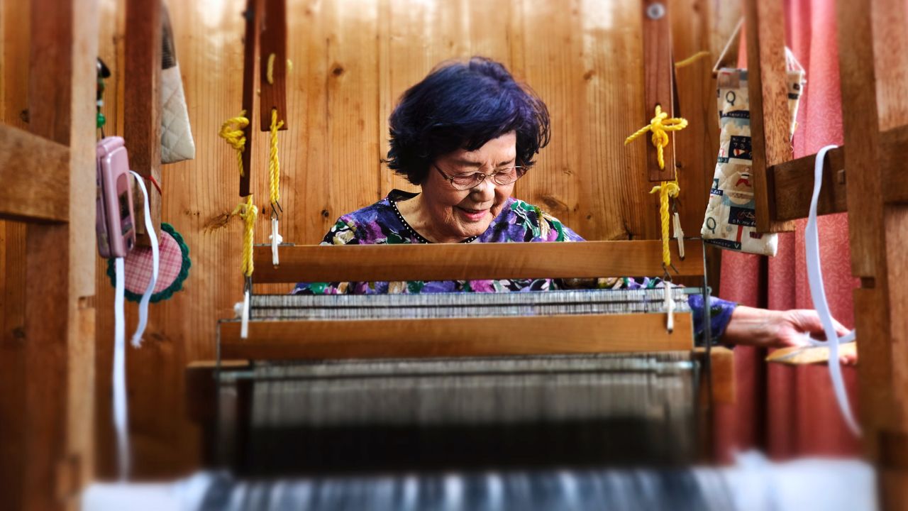 Natsuko Maenaka, 84, weaves and tries to learn new things to stave off dementia. 
