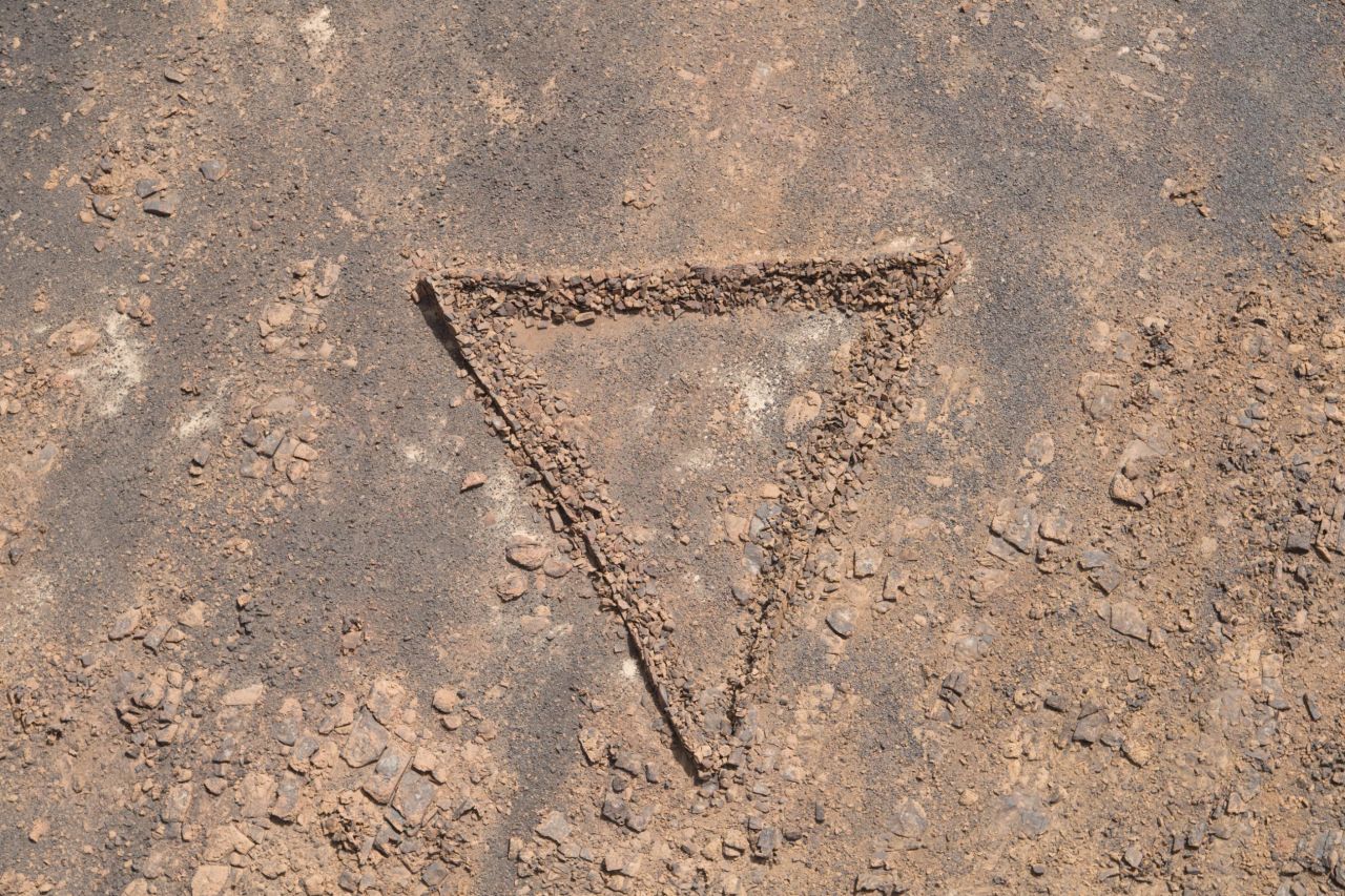 Most take the form of isosceles triangles and have been constructed with great precision so that the longest point is directed towards the grave.
