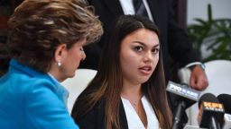 Current University of Southern California(USC) student Daniella Mohazab (R) speaks while seated beside attorney Gloria Allred at a press conference with former USC student Angela Esquivel Hawkins in Los Angeles, California on May 22, 2018. - A lawsuit has been filed against the University of Southern California (USC) on behalf of one of the students and calling on USC to conduct an independent investigation on allegations made by students alleging inappropriate conduct by Doctor George Tyndall, the gynecologist assigned to examine and treat USC students. (Photo by Frederic J. BROWN / AFP)        (Photo credit should read FREDERIC J. BROWN/AFP/Getty Images)