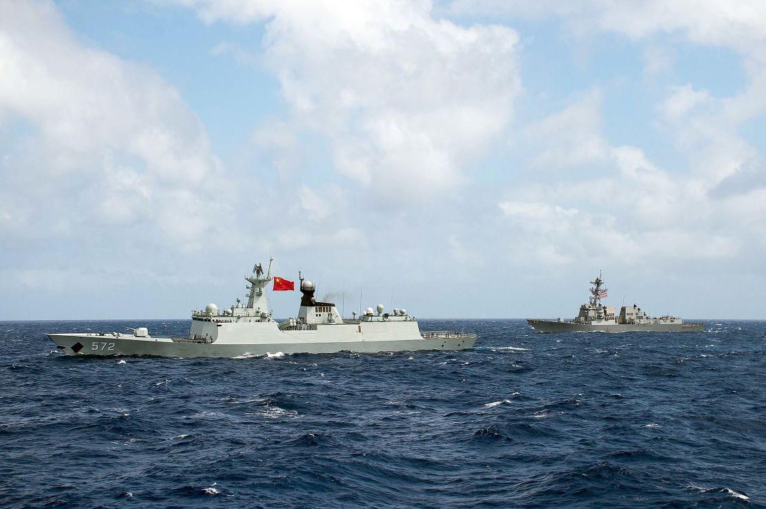 The People's Republic of China Chinese Navy frigate Hengshui and the guided-missile destroyer USS Stockdale transit in formation during RIMPAC 2016.