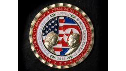 A coin for the upcoming US-North Korea summit is seen in Washington, DC, on May 21, 2018. - A commemorative coin featuring US President Donald Trump and North Korea's Kim Jong Un has been struck by the White House Communications Agency ahead of their summit meeting. The coin depicts Trump and Kim, described as North Korea's "Supreme Leader," in profile facing each other in front of a background of US and North Korean flags. The words "Peace Talks" are emblazoned at the top of the front of the coin with the date "2018" beneath. The summit is expected to take place in Singapore on June, 12, 2018. (Photo by STR / AFP)        (Photo credit should read STR/AFP/Getty Images)