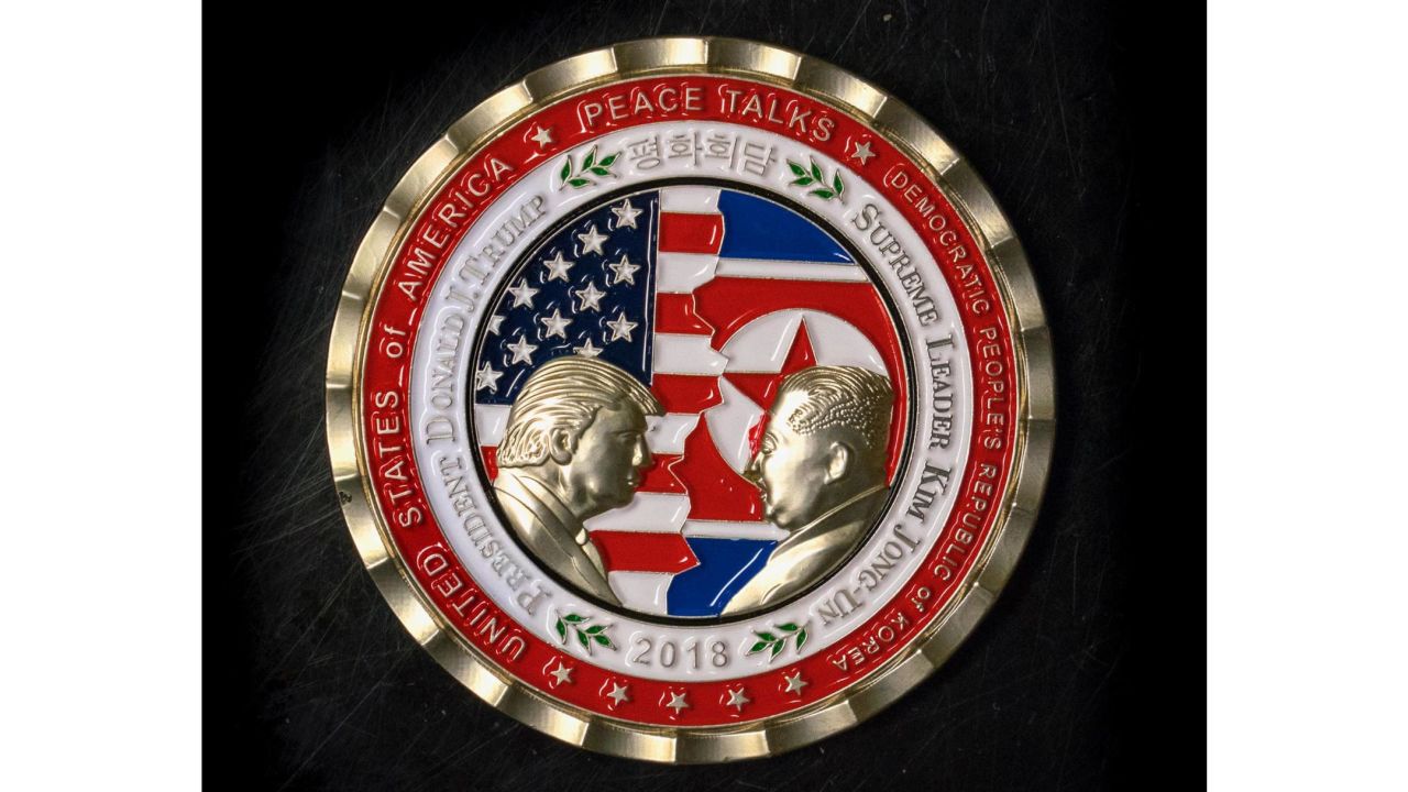 A commemorative coin featuring US President Donald Trump and North Korea's Kim Jong Un was struck by the White House Communications Agency ahead of their summit meeting, which Trump has cancelled. The coin depicts Trump and Kim, described as North Korea's "Supreme Leader," in profile facing each other in front of a background of US and North Korean flags. 