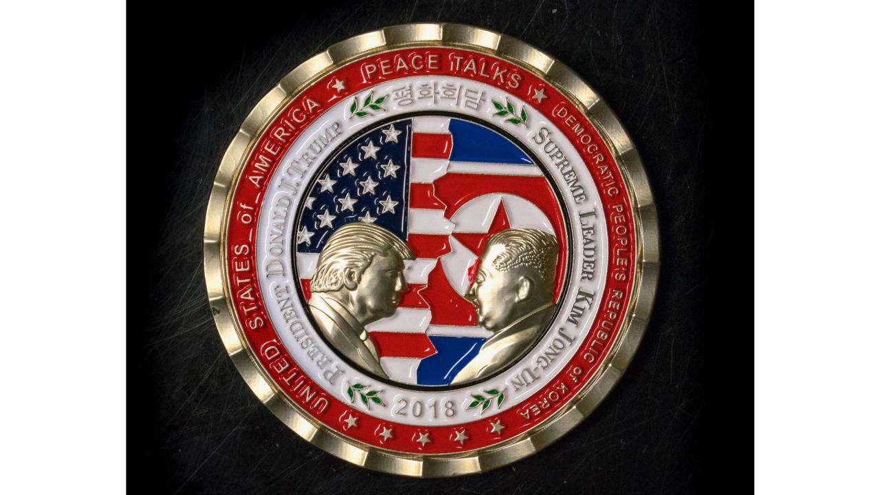A commemorative coin featuring US President Donald Trump and North Korea's Kim Jong Un was struck by the White House Communications Agency ahead of their summit meeting, which Trump has cancelled. The coin depicts Trump and Kim, described as North Korea's "Supreme Leader," in profile facing each other in front of a background of US and North Korean flags.