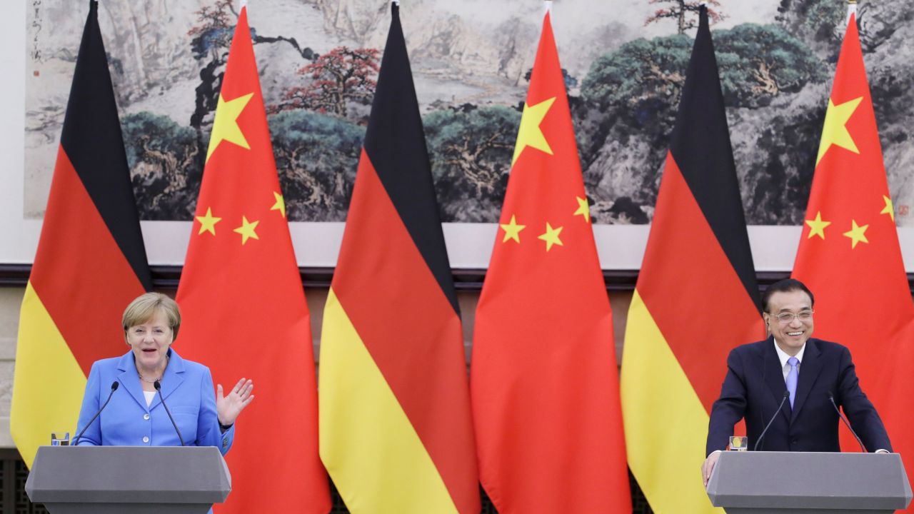 Chinese Premier Li Keqiang (R) and German Chancellor Angela Merkel attend a joint news conference at the Great Hall of the People in Beijing on May 24, 2018.