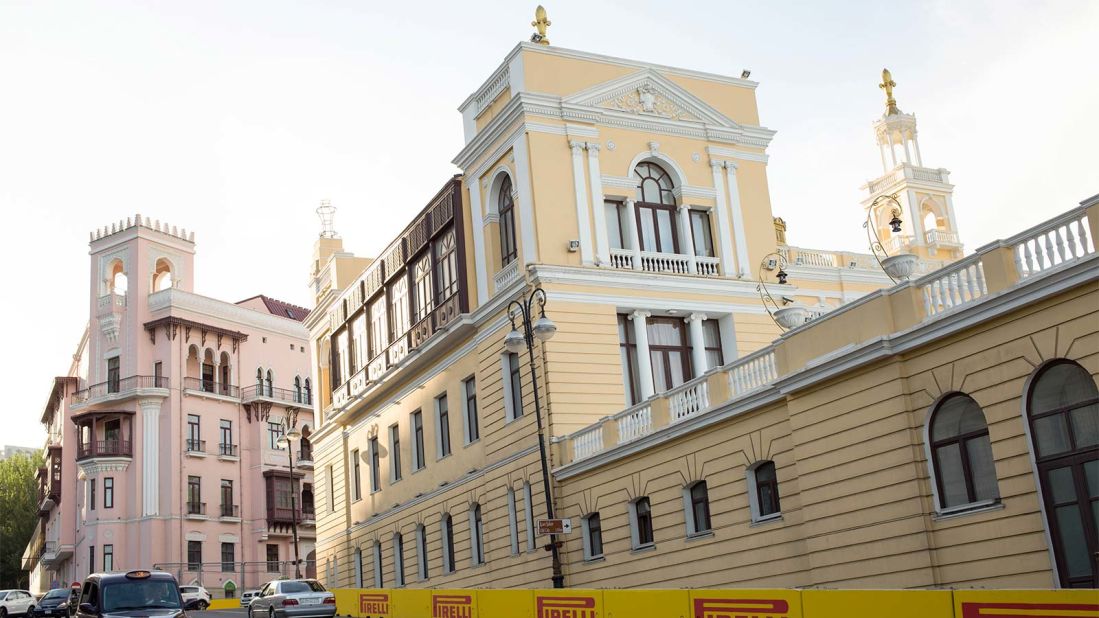 <strong>Baku's first electric lift:</strong> The pale-pink mansion of the Sadikhov brothers -- pictured left, beside the Philharmonic Hall -- had Baku's first electric lift, moving at a very leisurely 70 centimeters per second. 