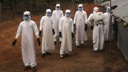 DISCO HILL, LIBERIA - JANUARY 27:  A burial team awaits decontamination at the U.S.-built cemetery for "safe burials" on January 27, 2015 in Disco Hill, Liberia. 