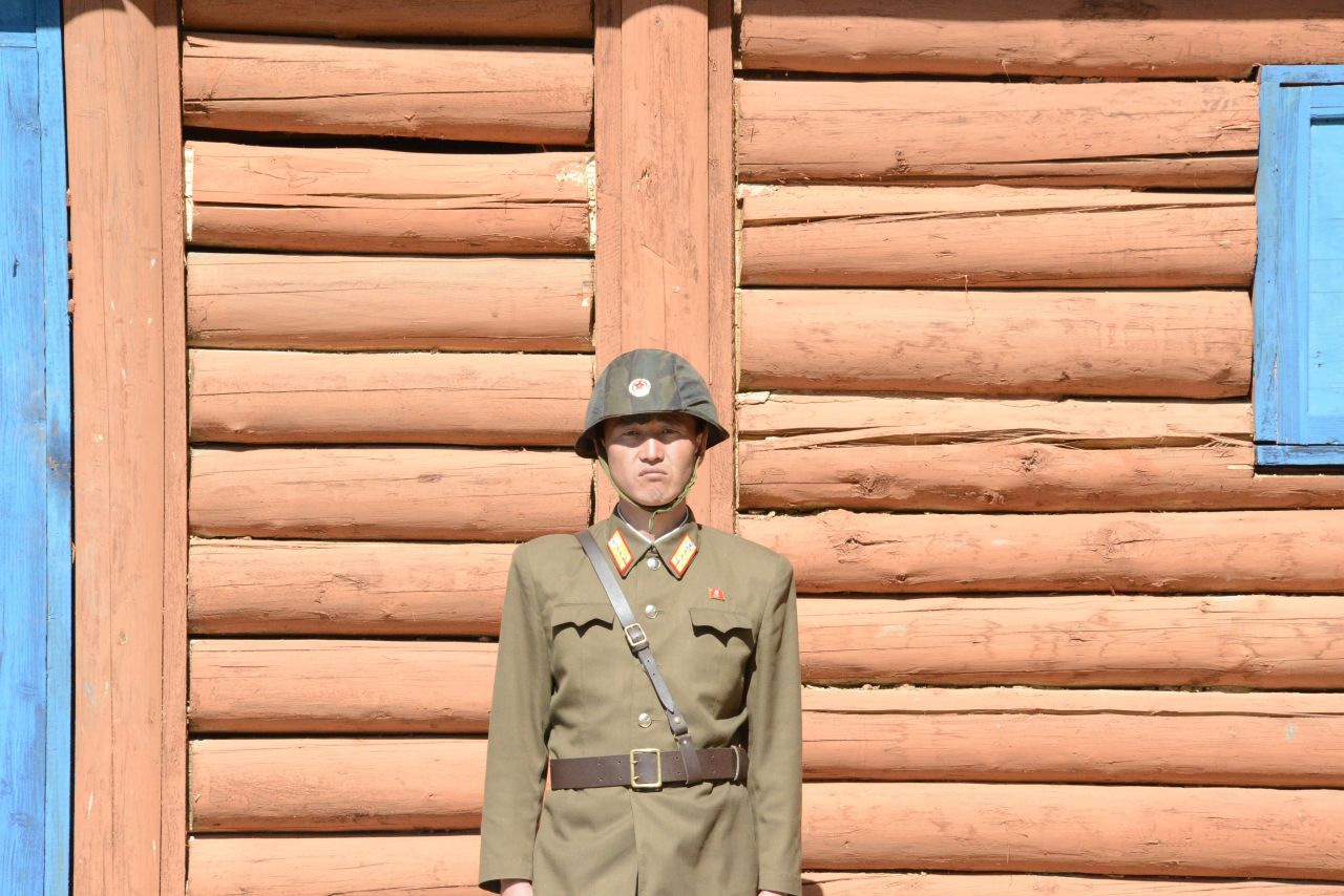 A close-up of a soldier standing guard in front of an observation building at tunnel 2.
