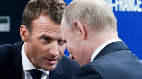 French President Emmanuel Macron and Russian President Vladimir Putin attend a meeting Friday with Russian and French businessmen during the St. Petersburg International Economic Forum.