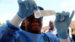 A health worker prepares an Ebola vaccine to administer to health workers during a vaccination campaign in Mbandaka, Congo, Monday, May 21, 2018. Congo's health minister says a nurse has died from Ebola in Bikoro, the rural northwestern town where the outbreak began, as the country begins a vaccination campaign. (AP Photo/John Bompengo)