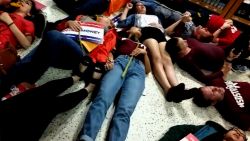 NS Slug: FL: PUBLIX DIE-IN HELD AGAINST CANDIDATE ADAM PUTNAM  Synopsis: Footage of several Marjory Stoneman Douglas students participating in a protest at a Coral Springs, FL Publix  Video Shows: - Footage of several Marjory Stoneman Douglas students participating in a protest at a Coral Springs, FL Publix by drawing chalk outlines in the parking lot and lied down for exactly 12 minutes in the store. - MSD student David Hogg called for a boycott of Publix due to them donating to gubernatorial candidate Adam Putnam, who has an "A" rating from the NRA.   Keywords: FLORIDA PUBLIX PROTEST NRA GUN SUPPORT
