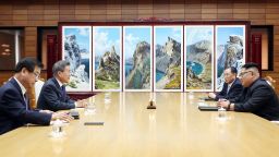 In this photo provided by South Korea Presidential Blue House via Yonhap News Agency, North Korean leader Kim Jong Un, right, and South Korean President Moon Jae-in, second from left, talk during a meeting at the northern side of the Panmunjom in North Korea, Saturday, May 26, 2018. Kim and Moon have met for the second time in a month to discuss peace commitments they reached in their first summit and Kim's potential meeting with President Donald Trump. (South Korea Presidential Blue House/Yonhap via AP)