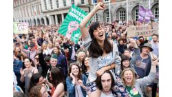A woman from the "Yes" campaign reacts after the final result was announced in the Irish referendum on the 8th Amendment of the Irish Constitution at Dublin Castle, in Dublin, Ireland, Saturday, May 26, 2018. Ireland appeared to move away from its conservative Roman Catholic roots and embrace a more liberal view Friday as two major exit polls predicted voters had repealed a constitutional ban on abortion. (AP Photo/Peter Morrison)