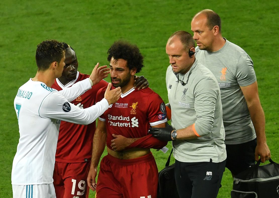 Ronaldo (left) consoles Liverpool's Mo Salah as he went off injured.  