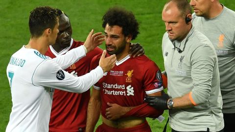 Ronaldo (left) consoles Liverpool's Mo Salah as he went off injured.  