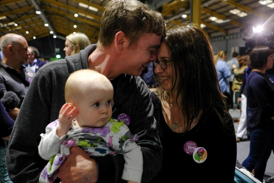 Amanda Mellet, with her husband James and daughter Ella at the count in Dublin Saturday. 