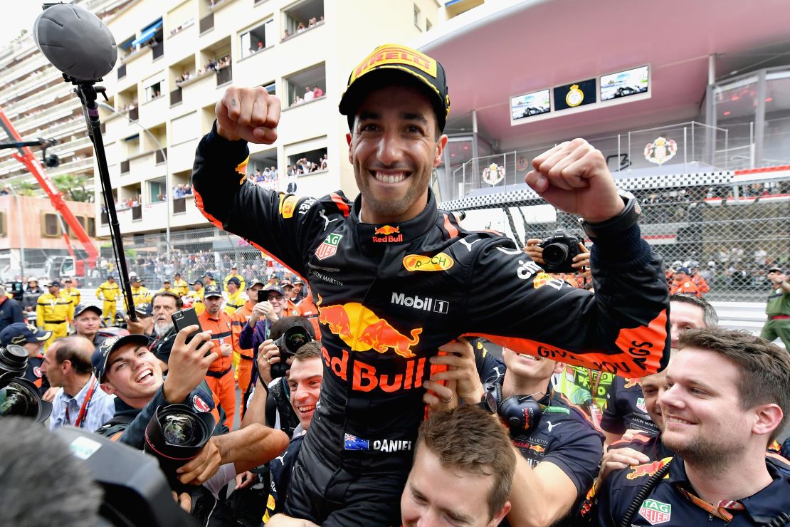 Ricciardo celebrates on the podium after claiming his maiden victory in the Monaco GP.