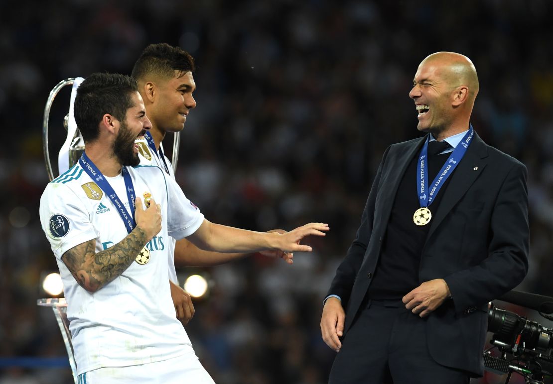 Real head coach Zidane shares a moment with Isco after Real Madrid's 3-1 victory over Liverpool in the Champions League final.