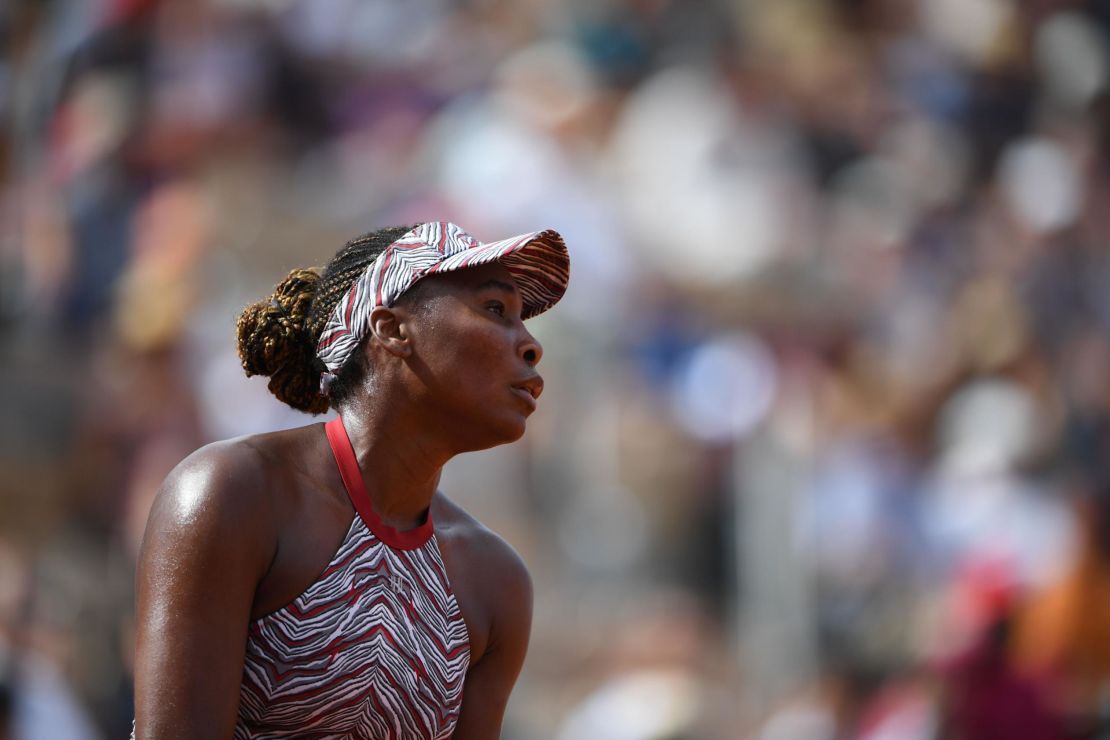 A dejected Venus Williams on her way to a shock defeat to China's Wang Qiang during their women's singles first round match at the French Open.