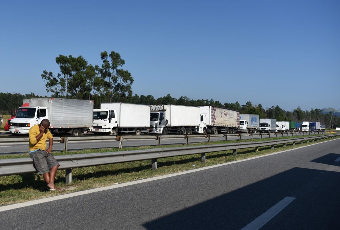Truck drivers block a road near Rio Friday.