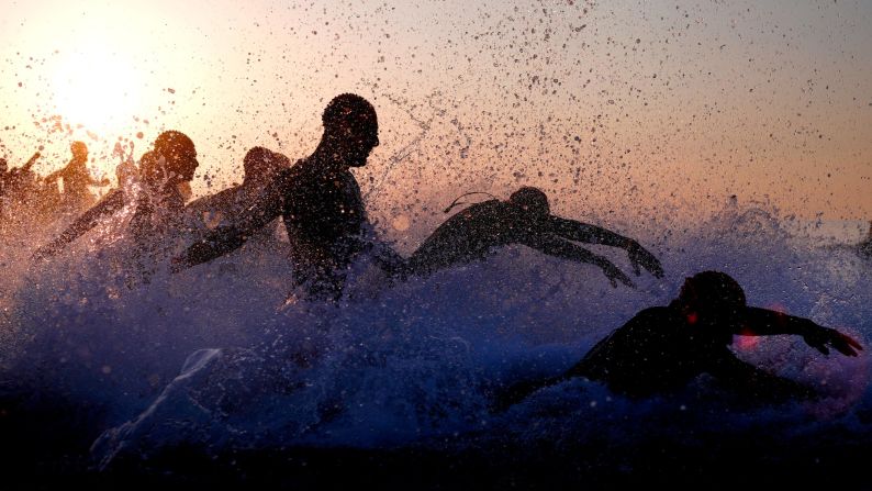 Participants begin the swim leg of the IRONMAN 70.3 Barcelona on Sunday, May 20. 