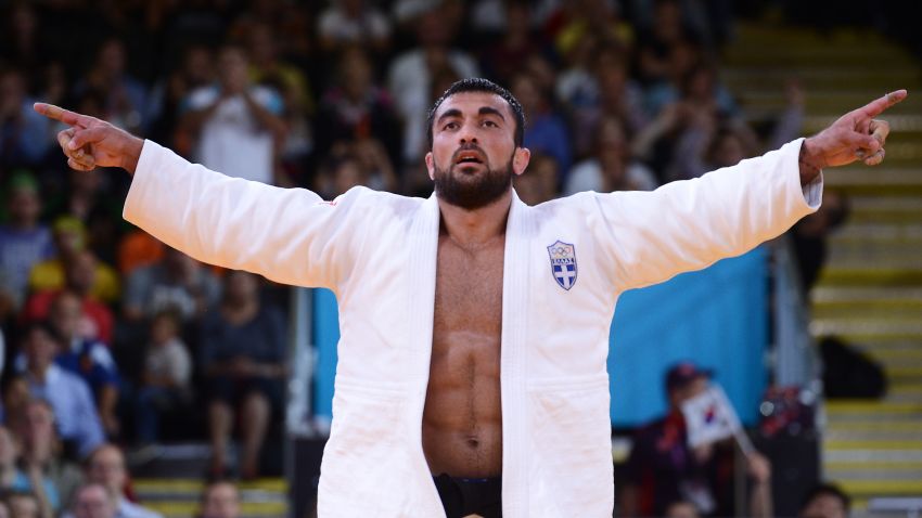 Greece's Ilias Iliadis celebrates after winning his men's -90kg judo contest bronze medal match of the London 2012 Olympic Games on August 1, 2012 at the ExCel arena in London. AFP PHOTO / FRANCK FIFE        (Photo credit should read FRANCK FIFE/AFP/GettyImages)