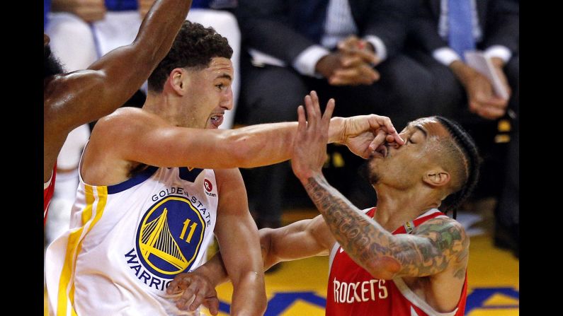 Golden State Warriors guard Klay Thompson passes the ball against Houston Rockets guard Gerald Green in game six of the NBA's Western Conference finals in Oakland, California, on Saturday, May 26.