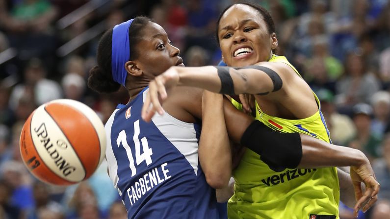 Minnesota Lynx forward Temi Fagbenle (14) and Dallas Wings forward Azura Stevens (30) fight for a rebound during a WNBA basketball game in Minneapolis, on Wednesday, May 23.
