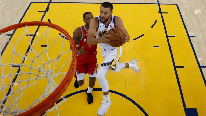 Stephen Curry of the Golden State Warriors goes up for a shot against Trevor Ariza of the Houston Rockets during Game 6 of the NBA's Western Conference finals in Oakland, California, on Saturday, May 26. <a href="index.php?page=&url=https%3A%2F%2Fwww.cnn.com%2F2018%2F05%2F20%2Fsport%2Fgallery%2Fwhat-a-shot-sports-0520%2Findex.html" target="_blank">See 27 amazing sports photos from last week </a>