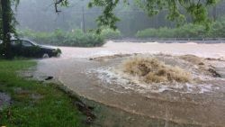 Flash flooding covers Rogers Avenue and Main Streets in Ellicott City, Md., Sunday, May 27, 2018. Flash flooding and water rescues are being reported in Maryland as heavy rain soaks much of the state. (Kenneth K. Lam/The Baltimore Sun via AP)