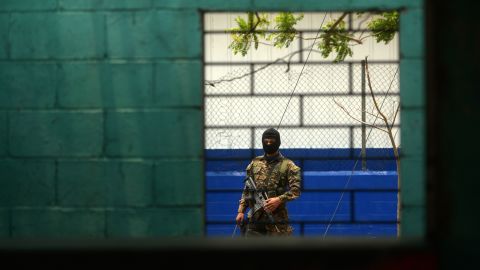 A member of a second contingent of the special reaction force, a combined army-police unit, stands guard after being deployed to deal with violence in Soyapango, El Salvador, on April 26, 2016.
Police and soldiers in El Salvador raided parts of the capital on Tuesday under a new campaign to break the reign of vicious gangs, officials said. The operation marked another move by the government to squeeze the gangs who have helped make the Central American nation infamous as the world's deadliest country outside of a war zone. Last week, authorities launched an elite Special Reaction Force of 1,000 police and troops to hunt gang leaders trying to take refuge in remote rural area and mountains. Tuesday's raids were carried out by another new taskforce made up of 800 police officers and soldiers focused on urban missions. Its units are known as the Interventional and Territorial Recovery Forces, or FIRT under the Spanish acronym.
 / AFP / Marvin RECINOS        (Photo credit should read MARVIN RECINOS/AFP/Getty Images)