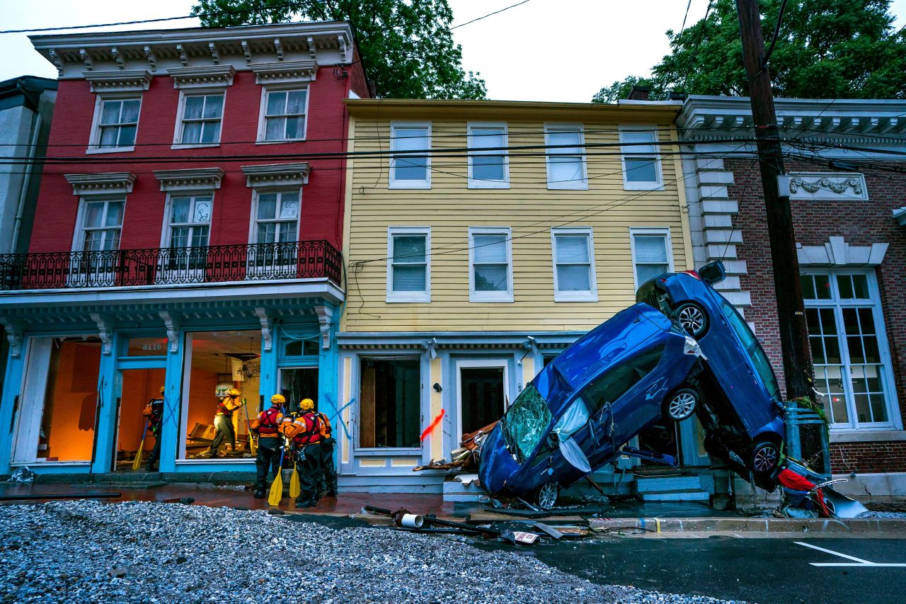 Rescue personnel examine damage on Main Street.
