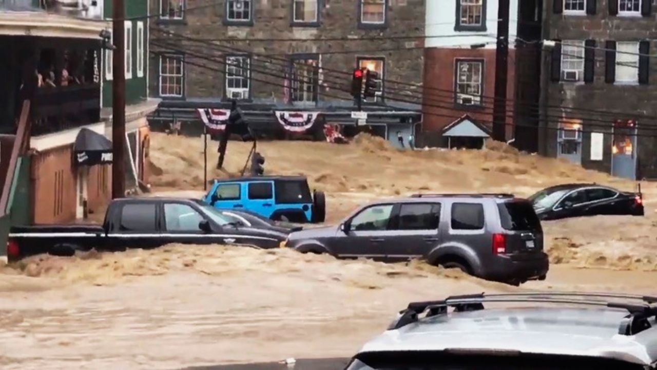 Floodwaters rush through Main Street on Sunday. Ellicott City is an unincorporated community about 12 miles west of Baltimore. It's in the valley of the Patapsco River, a major waterway flowing to the Chesapeake Bay.