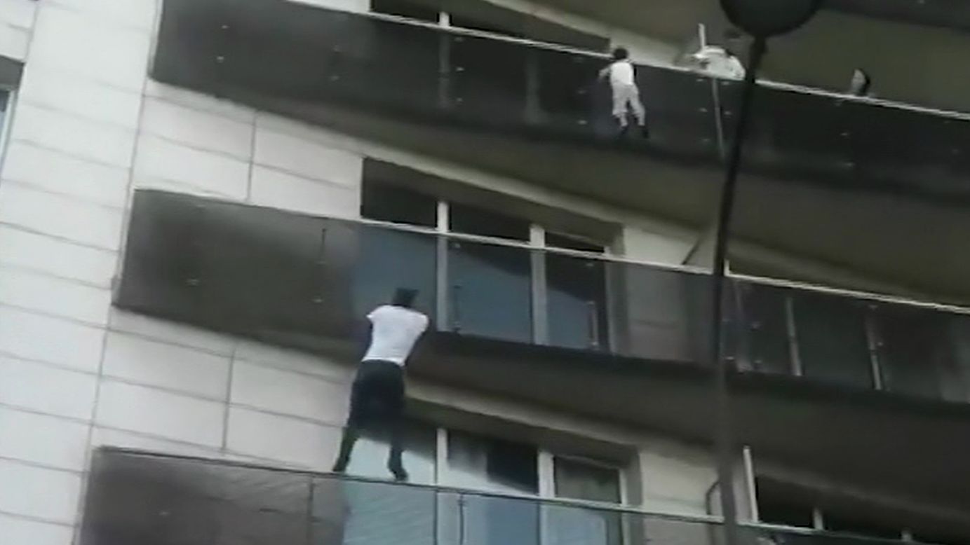 Mamoudou Gassama, a 22-year-old immigrant from Mali, climbs up a Paris apartment building to save a 4-year-old boy who was dangling precariously off a fifth-floor balcony on Saturday, May 26. Gassama was hailed as a hero, and French President Emmanuel Macron invited him to the Elysee Palace and offered him French citizenship. Gassama has also been offered a job with the Paris fire brigade. <a href="https://www.cnn.com/2018/05/29/europe/paris-balcony-rescue-photo-trnd/index.html" target="_blank">Related story: Your questions on the "Spider-Man" photo, answered</a>
